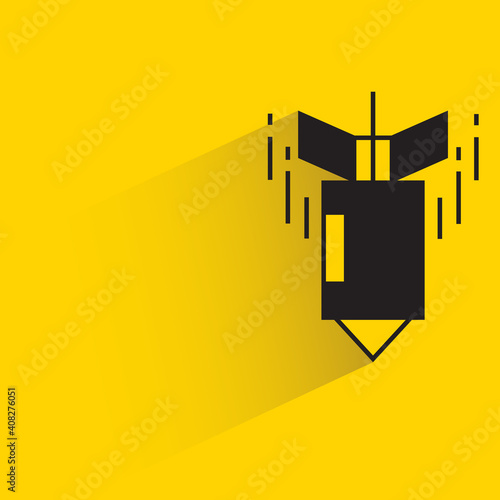 nuclear rocket with drop shadow on yellow background