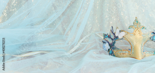 Wallpaper Mural Photo of elegant and delicate Venetian mask over gold and blue chiffon background Torontodigital.ca