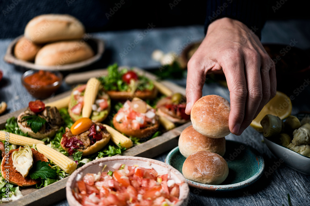 man preparing vegan sandwiches