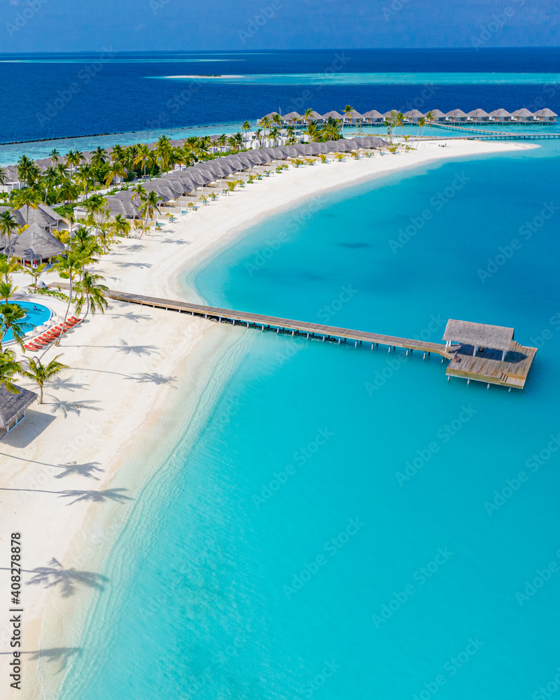 Fototapeta premium Sea beach aerial. Luxury summer travel vacation landscape. Tropical beach, drone view. Beach villas bungalows of hotel resort. Perfect beach scene vacation, summer holiday template. Wonderful nature