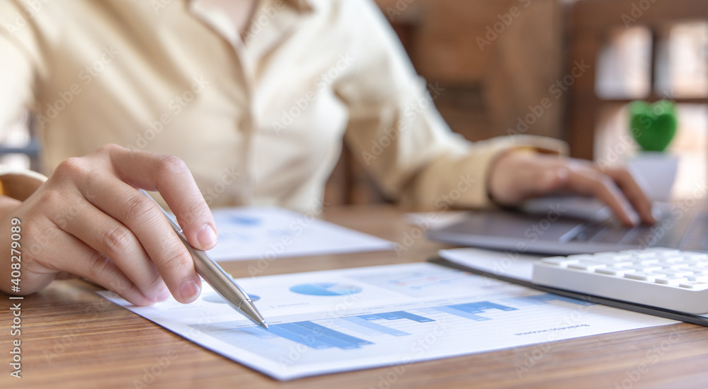 Meeting a team of businessmen, Executives and accountants meeting about the company's revenue graph in the office with laptops and calculators, Finance concept Meeting a team of businessmen, Executives and accountants meeting about the company's revenue graph in the office with laptops and calculators, Finance concept