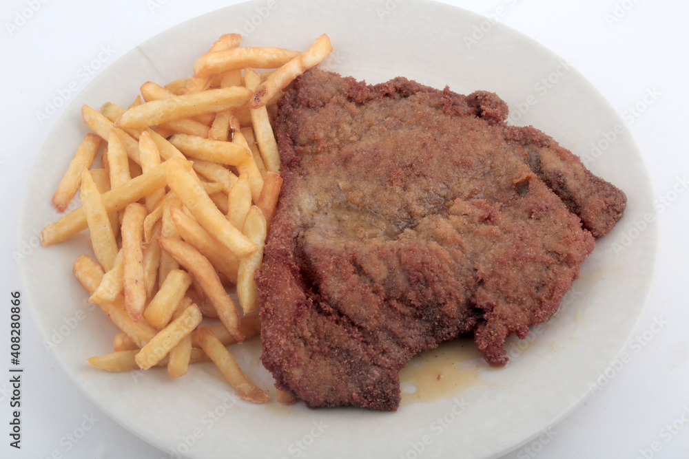 veal breaded meat with fried potatoes veal breaded meat with fried potatoes