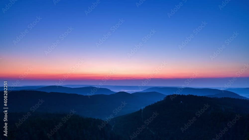 Time-lapse of German Black Forest at sunrise, rising sun and mountain scene Time-lapse of German Black Forest at sunrise, rising sun and mountain scene