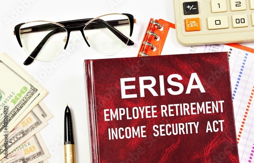 The ERISA Employee Retirement Security Act. Text inscription on the book. Sets minimum standards for retirement plans in private industry. photo