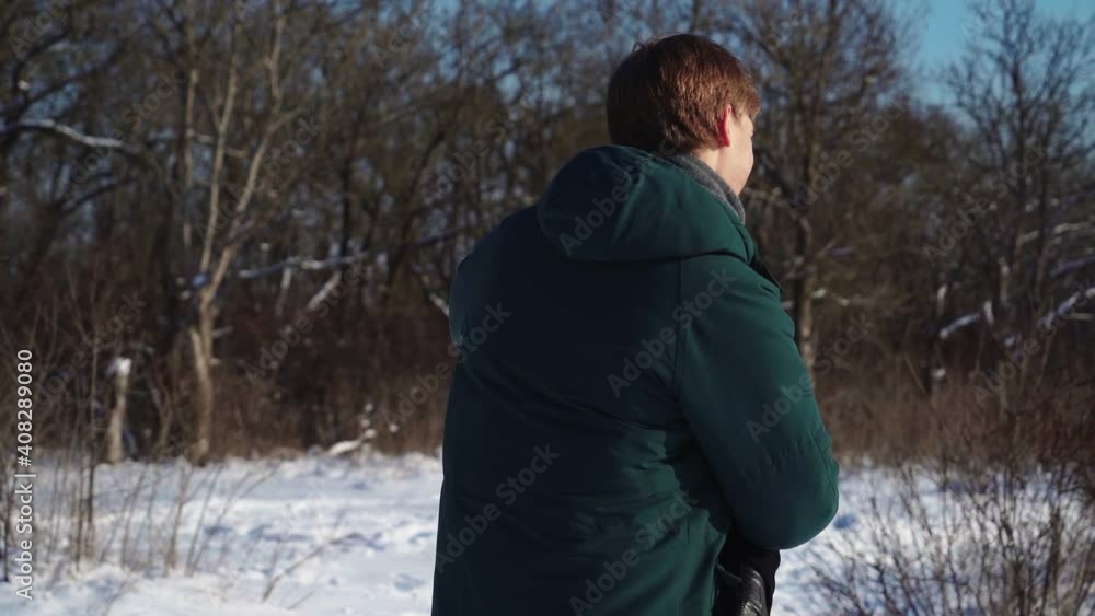 Young Lovers Stand and Hug in the Winter Forest. Lovely Man and Woman in an Embrace on the background of a Snowy Grove. Love and Family. Slow motion. High quality FullHD footage Young Lovers Stand and Hug in the Winter Forest. Lovely Man and Woman in an Embrace on the background of a Snowy Grove. Love and Family. Slow motion. High quality FullHD footage
