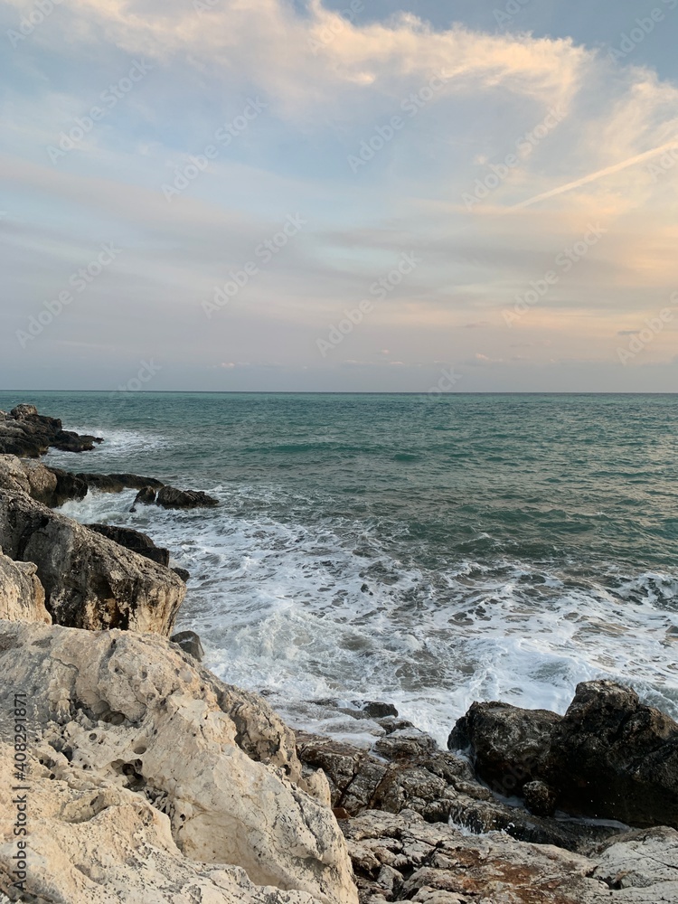 Sunset at the sea, rocky coastline, natural colors Sunset at the sea, rocky coastline, natural colors