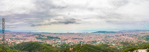 Panoramic picture of Barcelona city captured in a cloudy day.