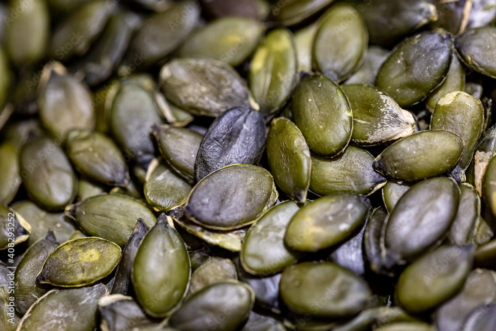 A full frame photograph of green pumpking seeds A full frame photograph of green pumpking seeds