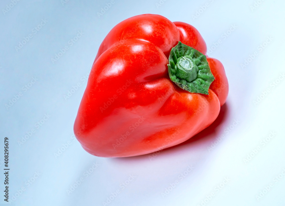 Single, fresh, ripe, bright red bell pepper isolated onwhite, macro Single, fresh, ripe, bright red bell pepper isolated onwhite, macro