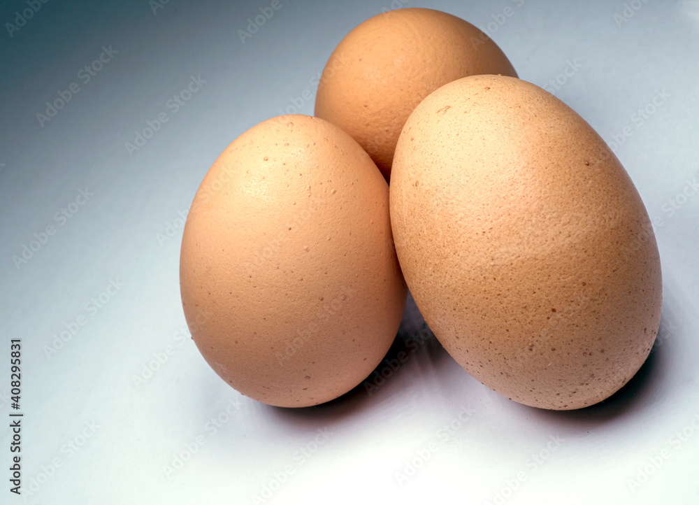 Three brown, speckled, chicken eggs on white, isolated, maceo Three brown, speckled, chicken eggs on white, isolated, maceo