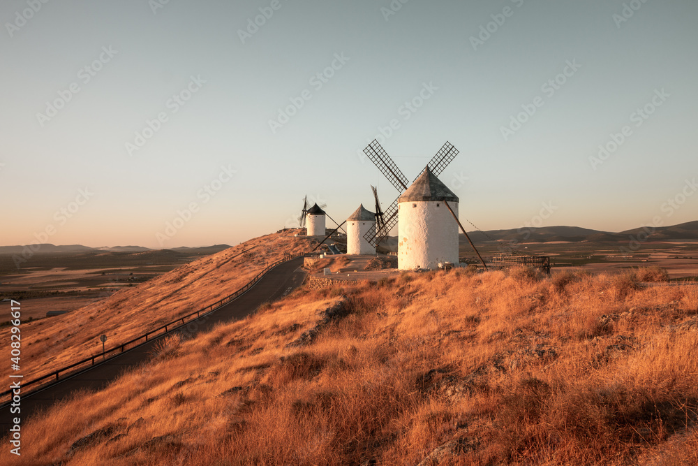 Fototapeta premium Windmills situed in Castilla la Mancha, Spain, captured during sunrise.