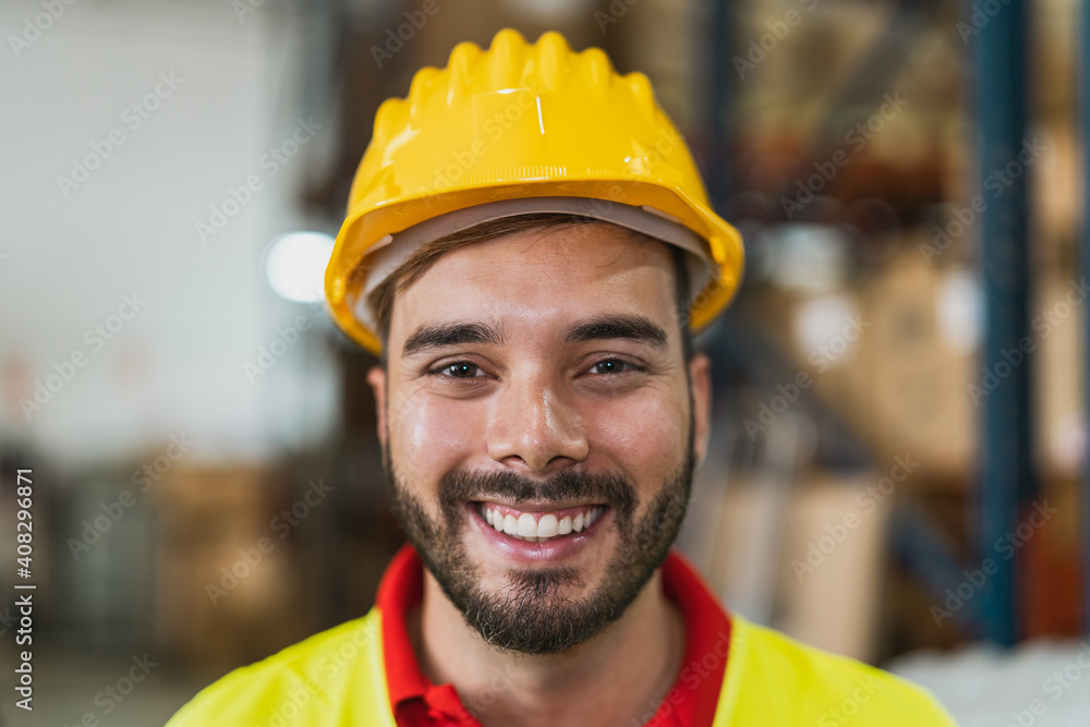 Portrait of happy young man working in delivery warehouse - Logistic and industry concept Portrait of happy young man working in delivery warehouse - Logistic and industry concept