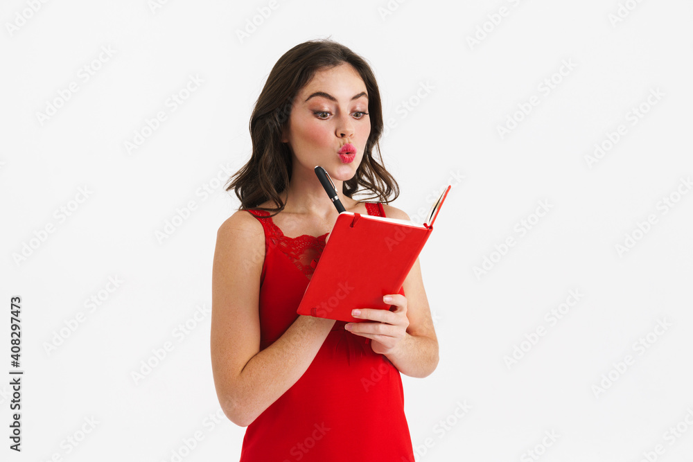 Thinking beautiful girl writing down notes in planner Thinking beautiful girl writing down notes in planner