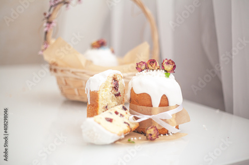 Traditional russian easter bread on table. The decorarion of kulich are the flower are eating on spring holiday