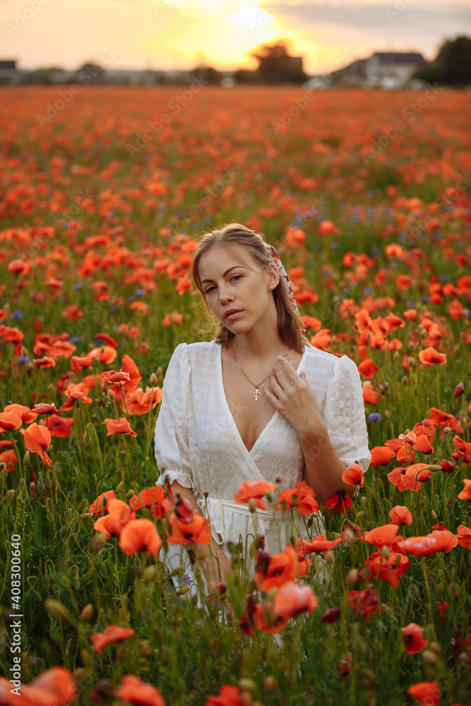 portrait of a girl in a white dress in a field of red poppies portrait of a girl in a white dress in a field of red poppies