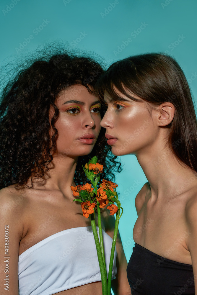 Attractive women with a flower bouquet in the middle Attractive women with a flower bouquet in the middle