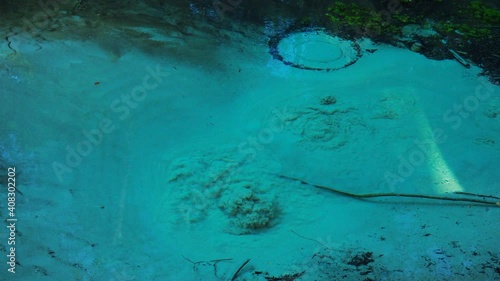 Bubbling Green wellspring, the most famous source of natural mineral water. The most famous source of natural mineral water, bubbling wellspring. Green wellspring in Mari El, Russia photo