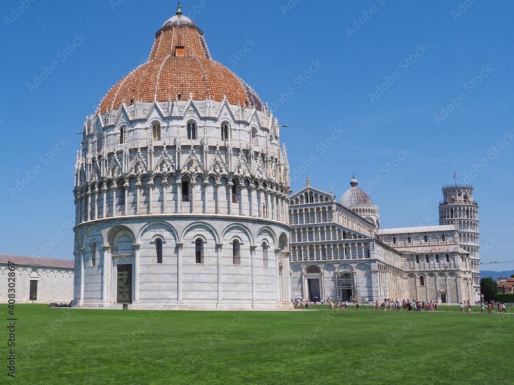 Pisa, historic center. Famous UNESCO complex, San Giovanni or St. John Baptistery, Cathedral or Duomo di Santa Maria Assunta and famous Leaning Tower of Pisa or campanile. View of Piazza dei Miracoli.