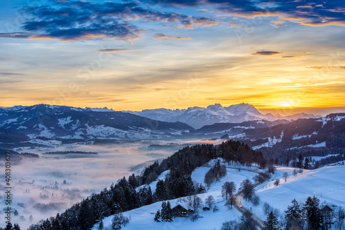 awesome winter landscape at sunset with  view from the Allgau Alps over the Bregenzer Wald in Austria to Mount Saentis in Switzerland © Uwe
