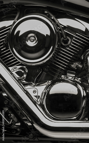 Close-up of a shiny black motorbike engine photo