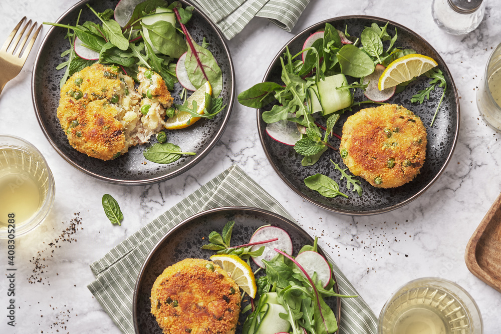 Smoked mackerel fishcakes served with a rocket, spinach salad Smoked mackerel fishcakes served with a rocket, spinach salad
