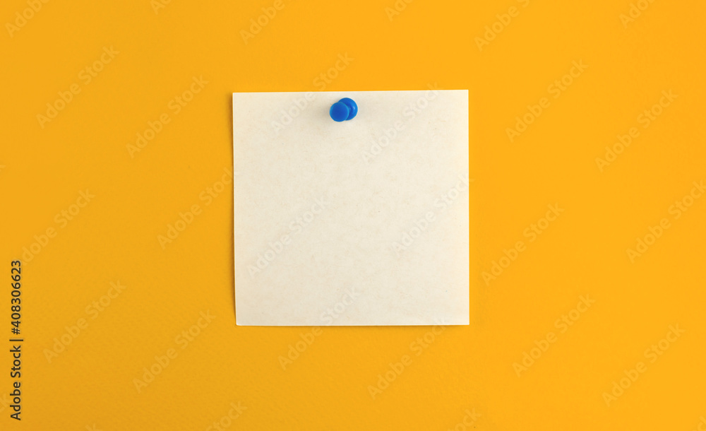 Pinned notepad sheet of square paper on isolated yellow background, for message and work letters Pinned notepad sheet of square paper on isolated yellow background, for message and work letters