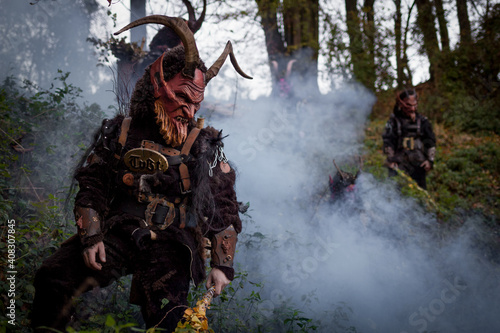 Krampus im Nebel des Waldes. Brauchtum bzw Tradition in Österreich photo