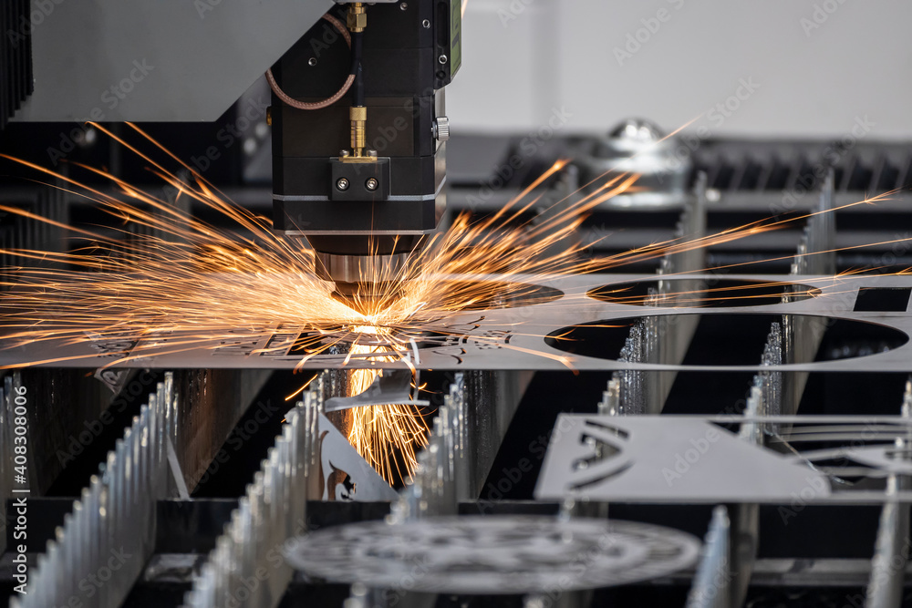The fiber laser cutting machine cutting machine cut the metal plate. The  hi-technology sheet metal manufacturing process by laser cutting machine.  Stock Photo | Adobe Stock