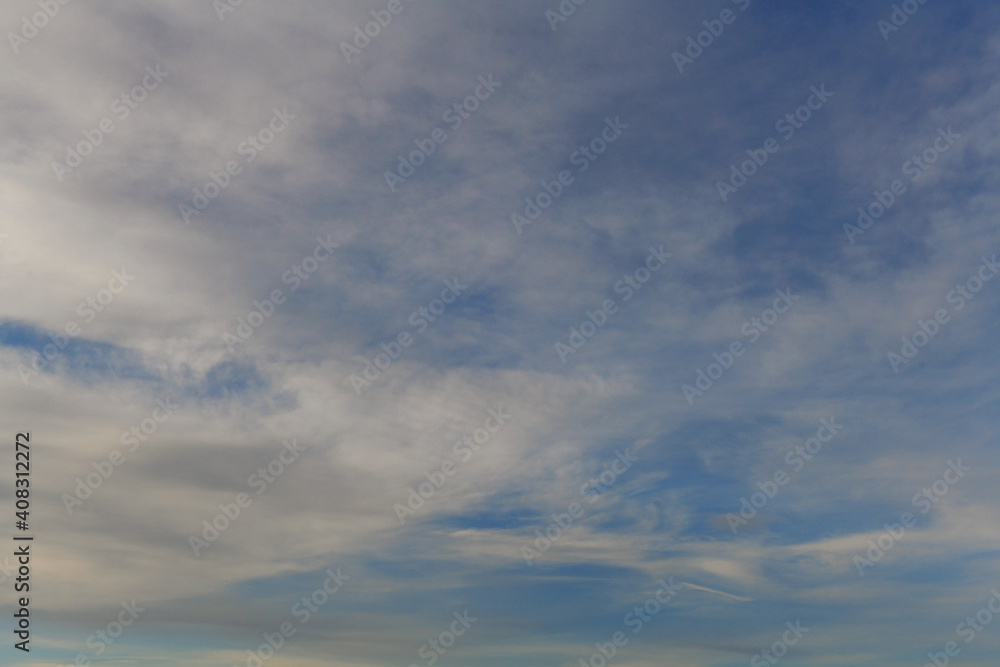 blue sky background with tiny clouds in the afternoon blue sky background with tiny clouds in the afternoon