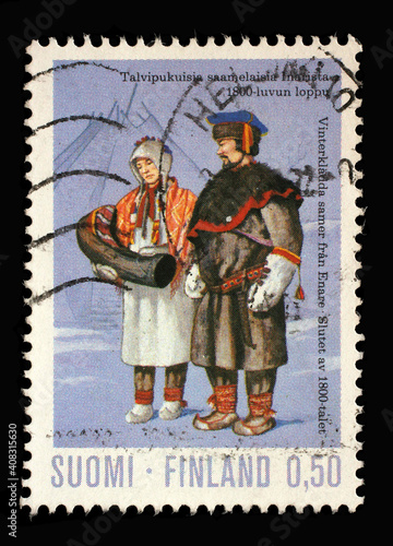 Stamp printed in the Finland shows Sami people in Winter Costume (19th Century), circa 1972 © zatletic