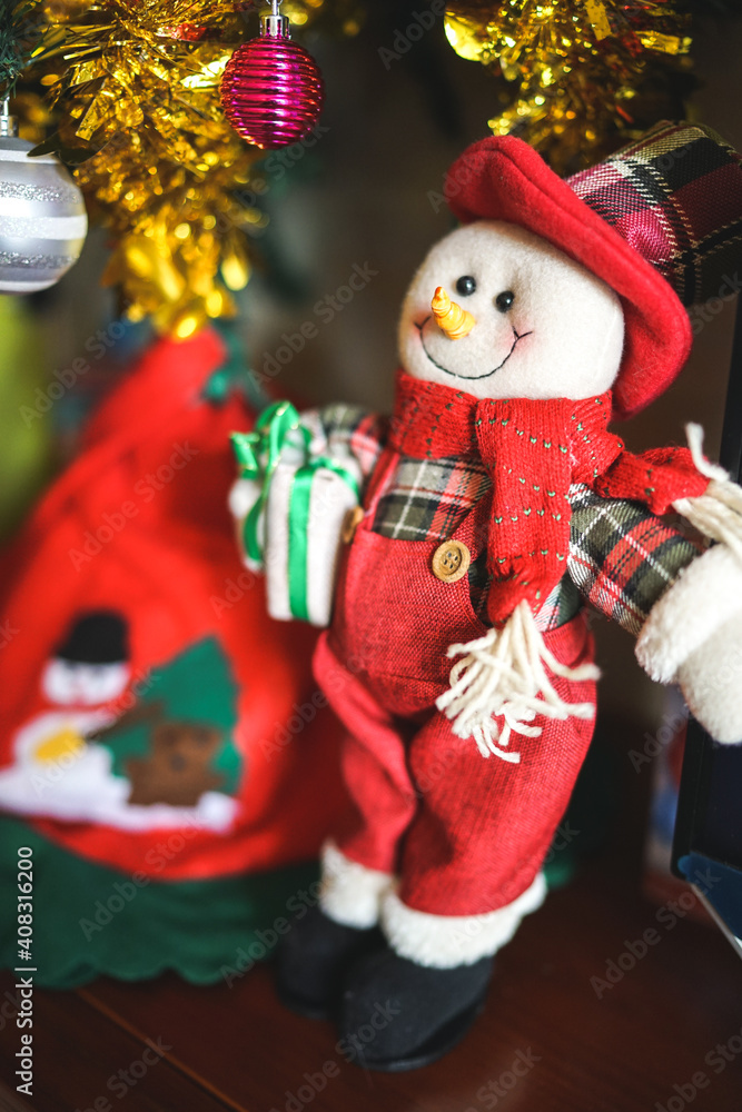 Snowman Santa Claus with gifts under the Christmas tree Snowman Santa Claus with gifts under the Christmas tree