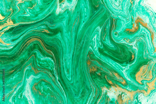 Green marble abstract acrylic background. Marbling artwork texture. Agate ripple pattern. Gold powder.