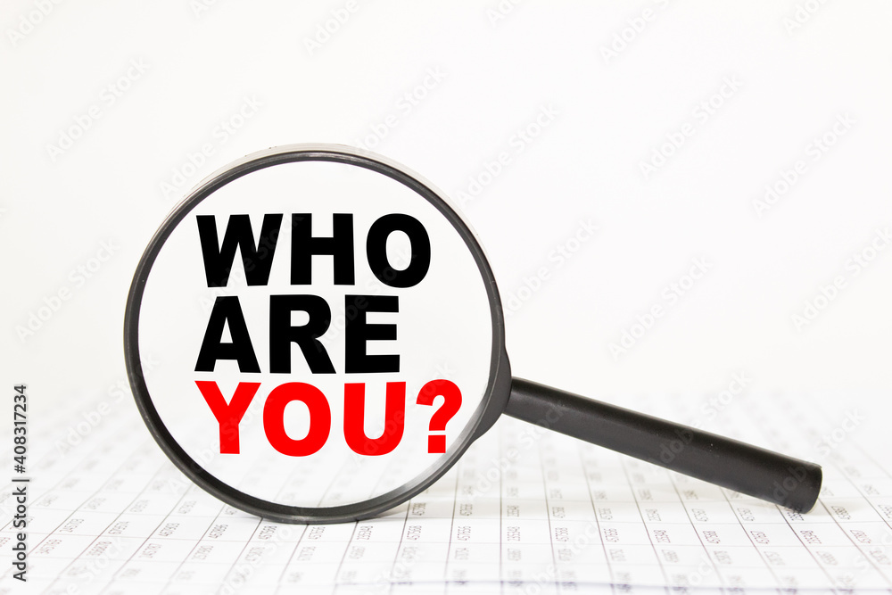 words WHO ARE YOU in a magnifying glass on a white background. business concept words WHO ARE YOU in a magnifying glass on a white background. business concept
