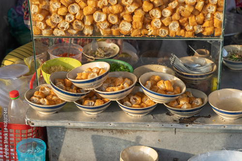 Cut deep-fried bread sticks - youtiao at breakfast stall on the street