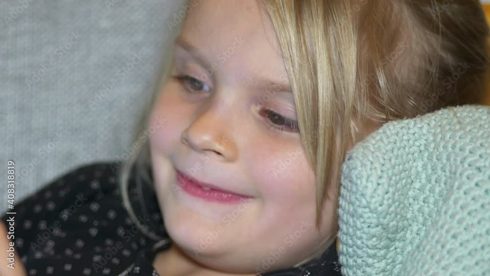 Extreme Close up portrait of happy five year old girl at home, shallow depth of field slow motion Extreme Close up portrait of happy five year old girl at home, shallow depth of field slow motion