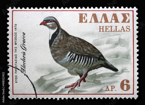 Fotografie, Obraz Stamp printed in Greece shows rock partridge (Alectoris graeca), series European