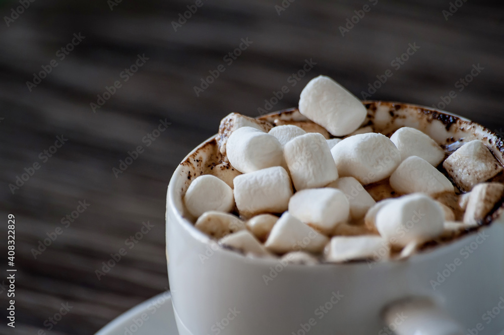 cup of coffee with marshmallows on a wooden table cup of coffee with marshmallows on a wooden table