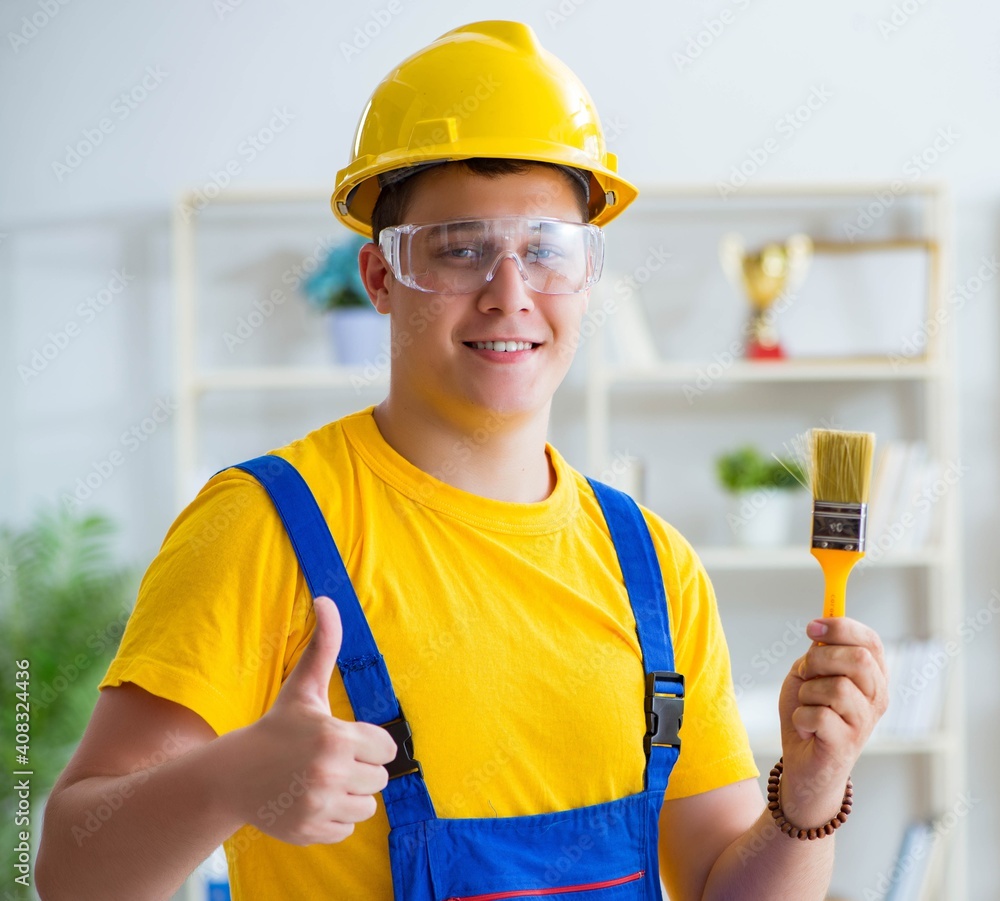 Painter working at home in refurbishment project Painter working at home in refurbishment project