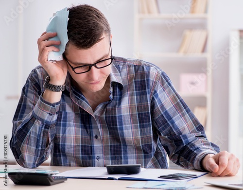 Young man frustrated at his house and tax bills