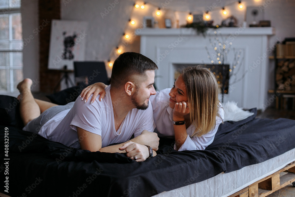 a couple of lovers hugging on the bed a couple of lovers hugging on the bed