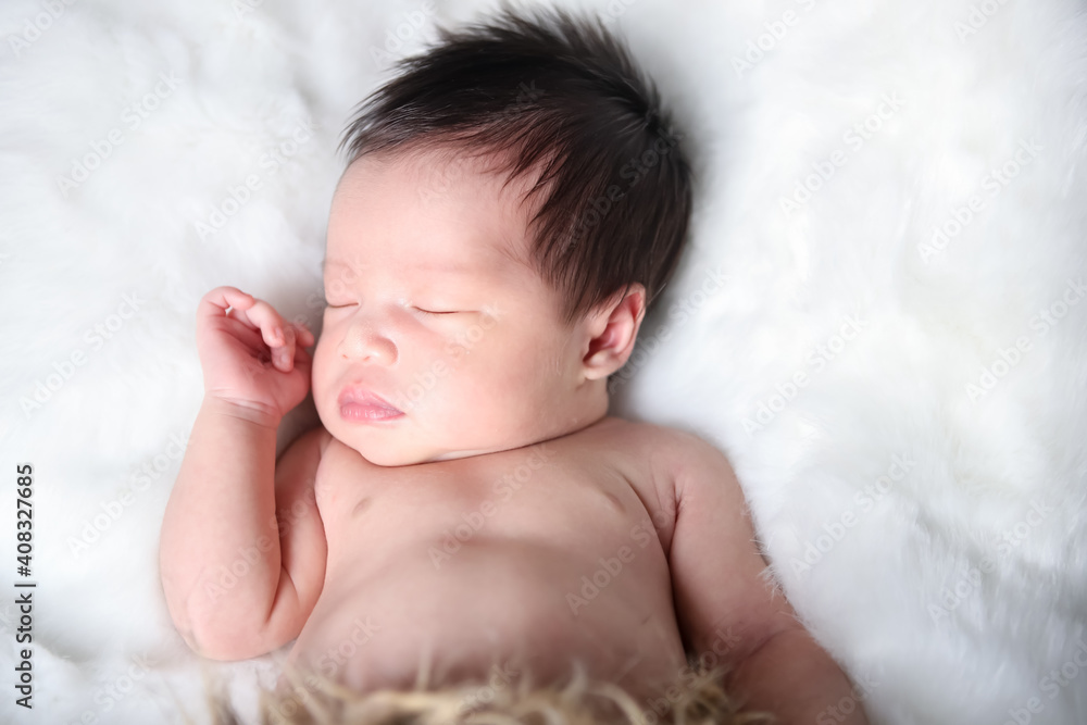 A beautiful newborn girl sleeping on a white soft blanket, Infant, babyhood concept - Image A beautiful newborn girl sleeping on a white soft blanket, Infant, babyhood concept - Image