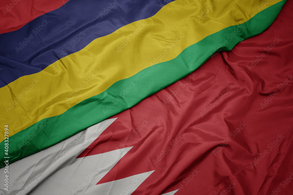 waving colorful flag of bahrain and national flag of mauritius.