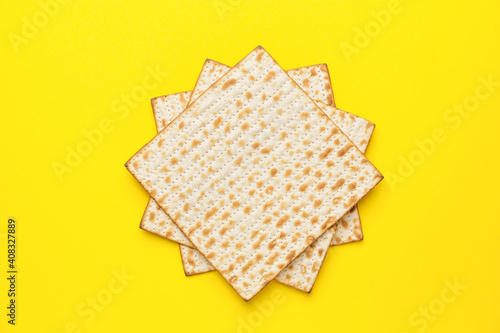 Jewish flatbread matza for Passover on color background photo