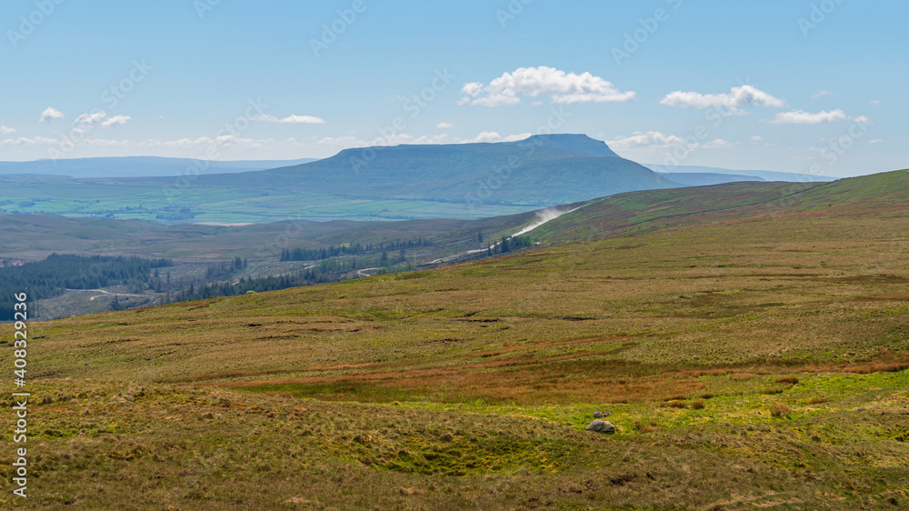 Fototapeta premium A cloudy day in the Yorkshire Dales with Pen-Y-Ghent in the background near Oughtershaw, North Yorkshire, England, UK