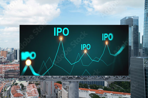 IPO icon hologram on road billboard over day time panorama city view of Singapore. The hub of initial public offering in Southeast Asia. The concept of exceeding business opportunities.