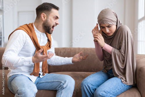 Photography Aggressive Muslim Husband Shouting At Scared Wife Sitting At Home
