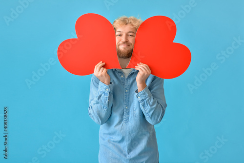 Handsome man with big red h...