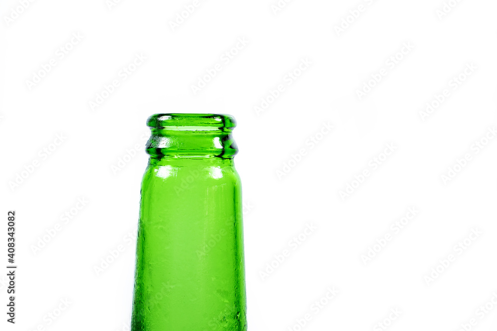 the neck of an empty green frozen beer bottle on a white background the neck of an empty green frozen beer bottle on a white background