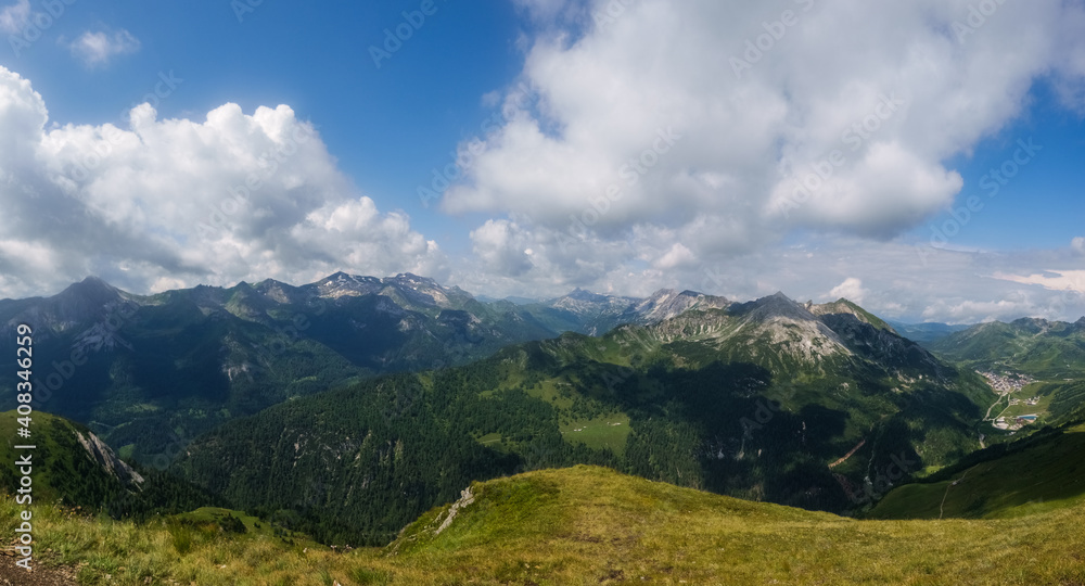 wonderful mountains with summits while hiking in the summer panorama