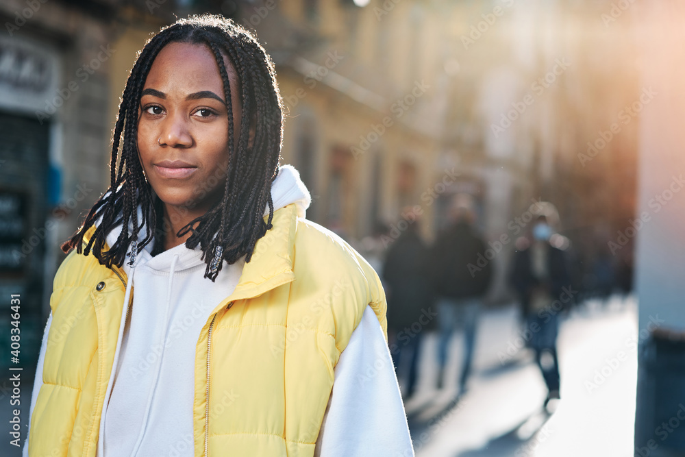 Fototapeta premium Woman looking to the camera outdoors on the street.